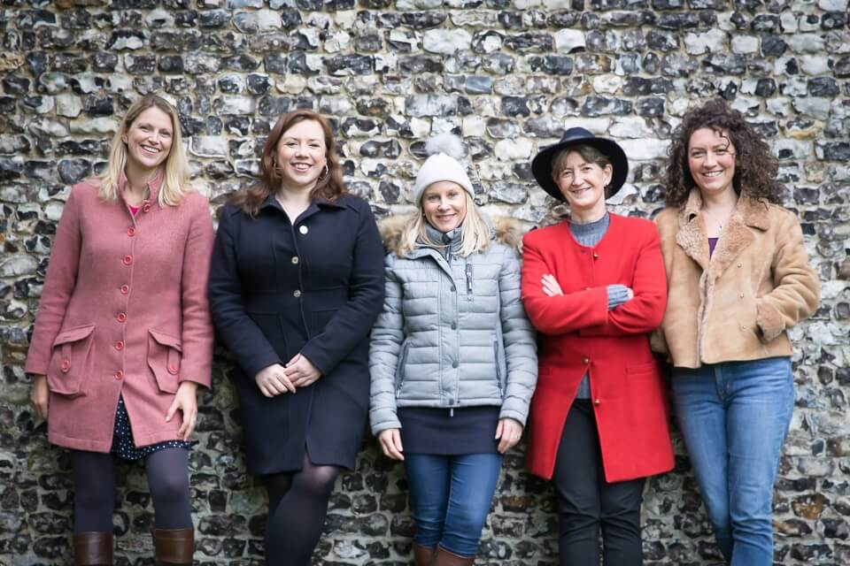 Group in front of brick wall